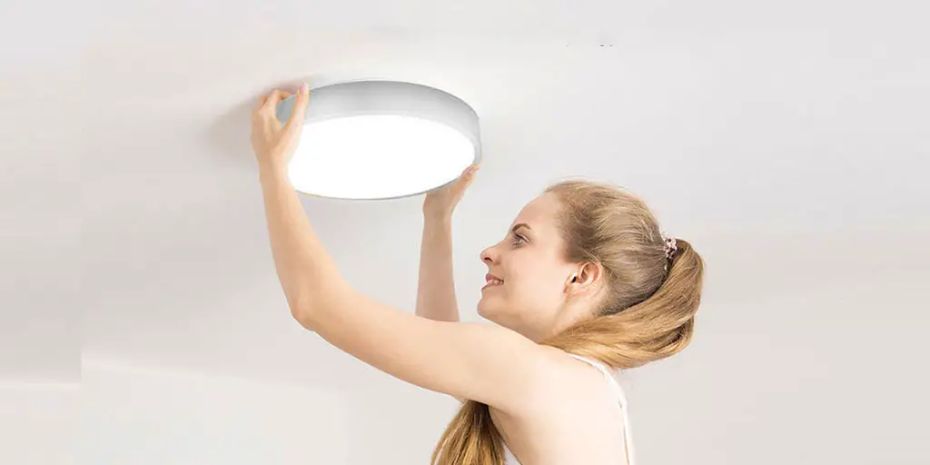 Learn how to remove ceiling light cover: no screws, no problem!